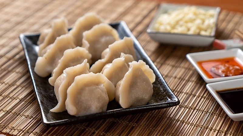 Assorted dumplings with condiments